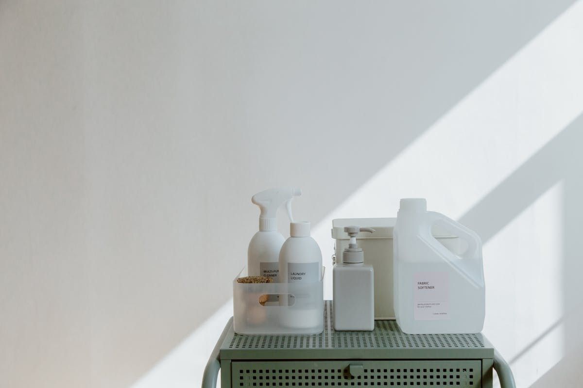 Minimal set of essential cleaning products arranged neatly