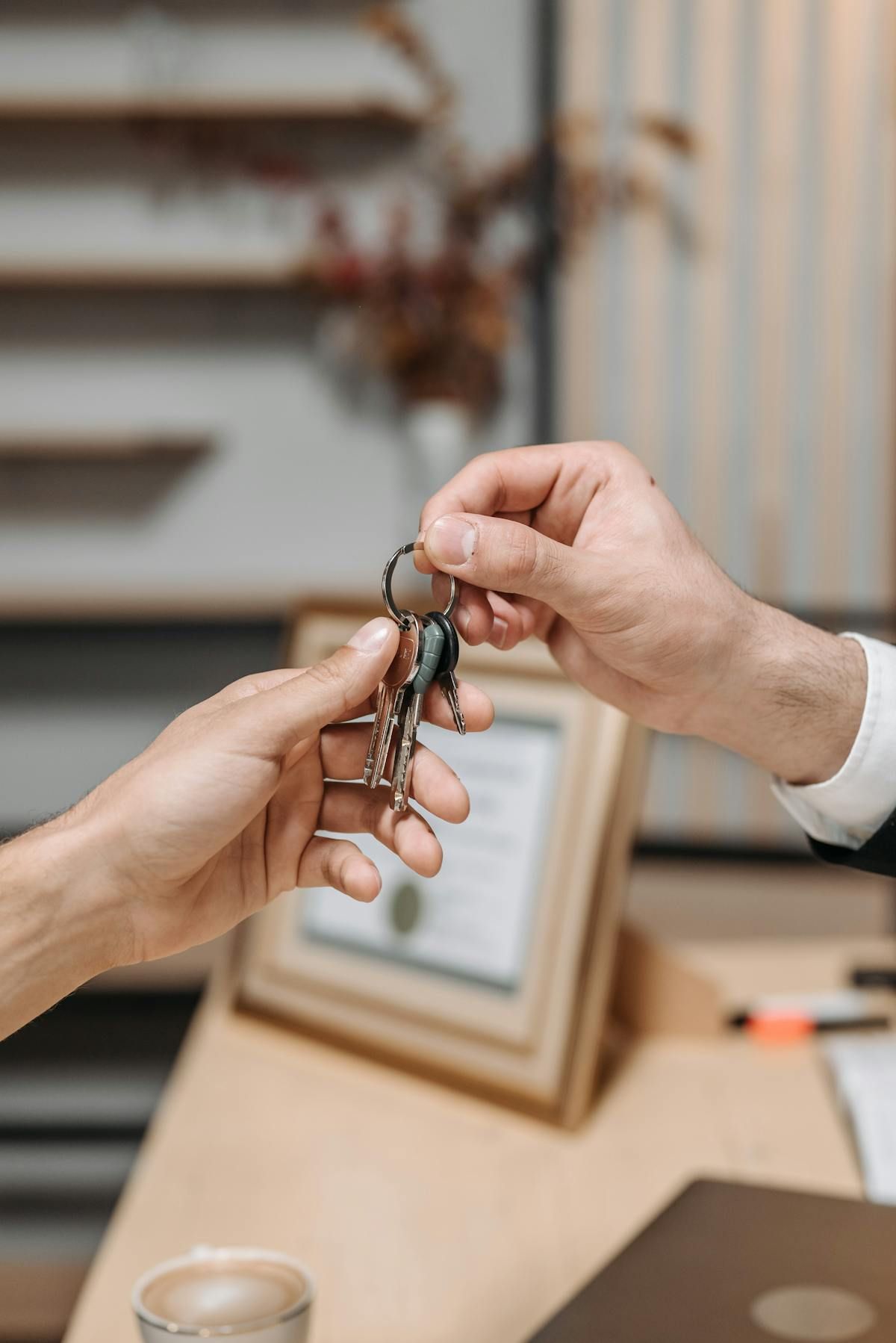 Real estate agent handing over keys after professional turnover cleaning